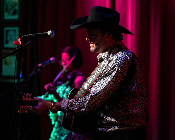 They Strum and Bow for Us